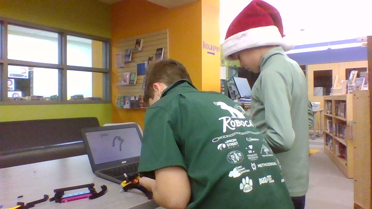 Ezra L. and Walter B. work furiously on building a robot.